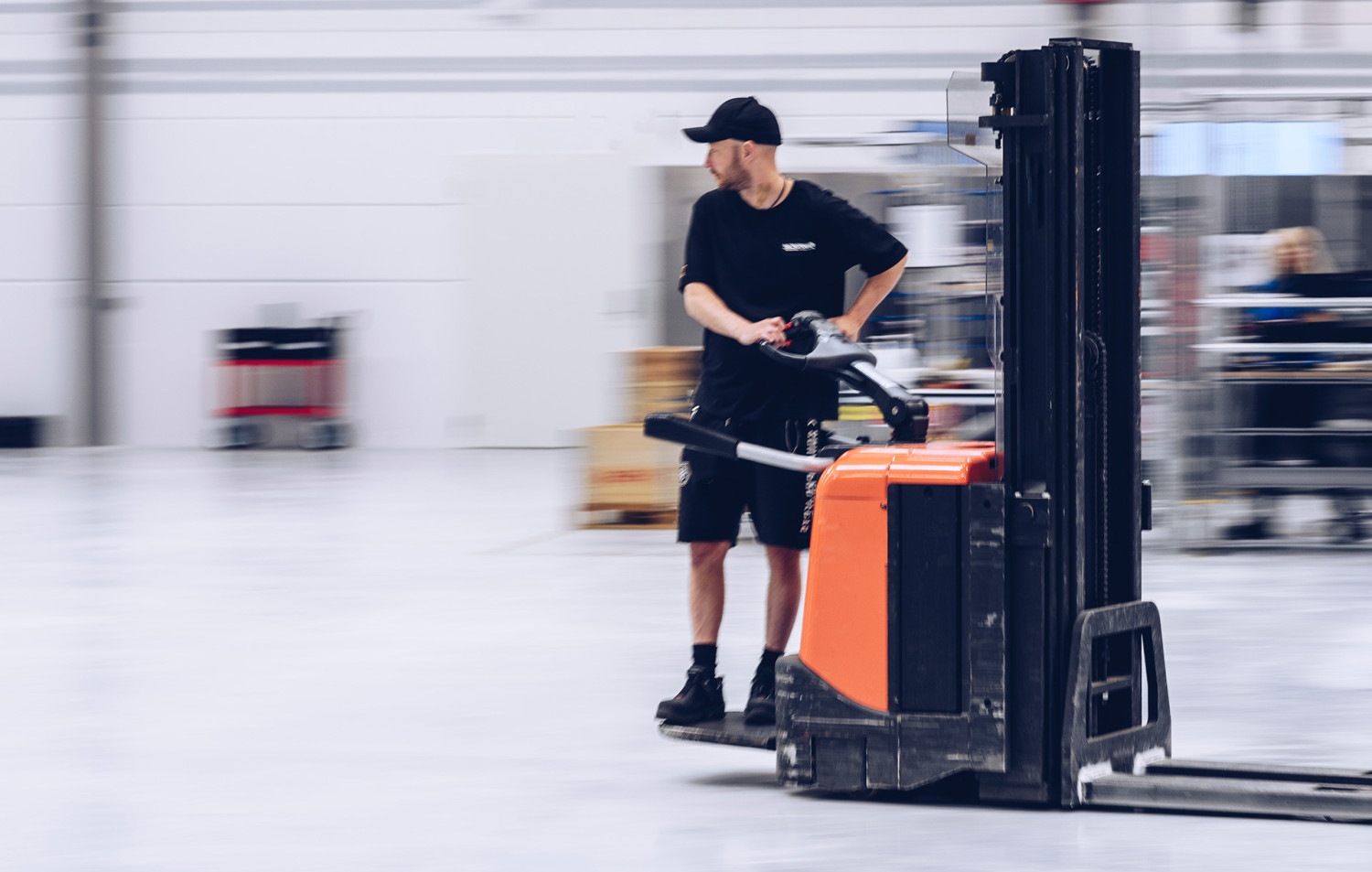 An employee at Micropower drives a forklift